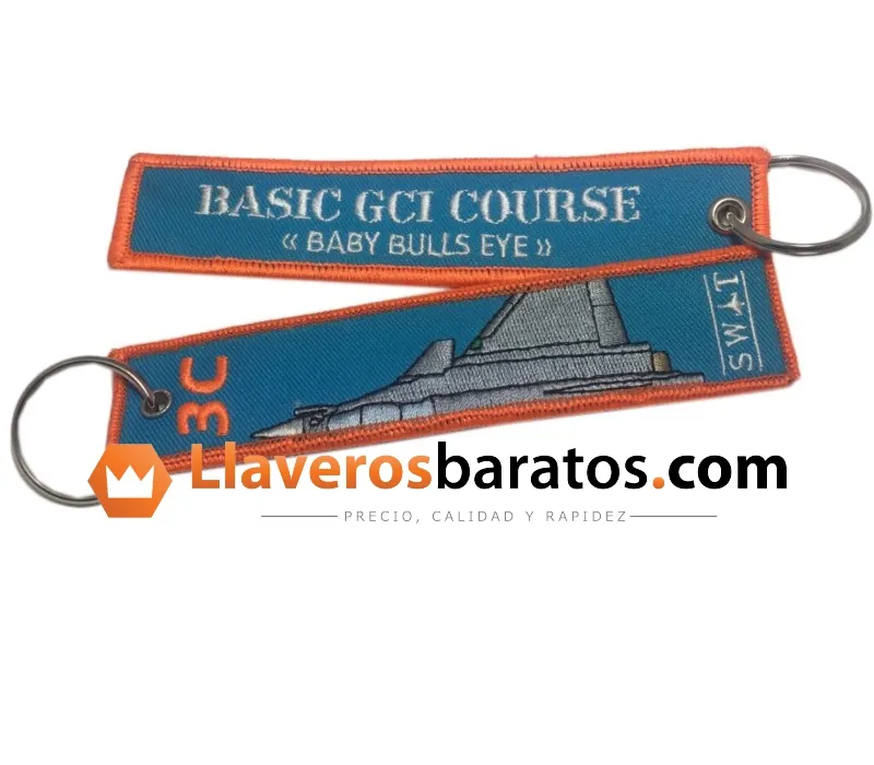 Llavero de tela bordado azul y naranja de curso de vuelo